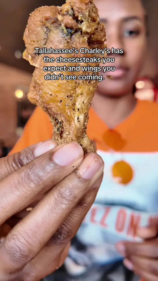 Coosh's Bayou Rouge in Tallahassee showing wings, lemon pepper wings, hot honey sauce wings, strawberry lemonade, peach lemonade, loaded fries, original cheesesteak, video by beewithbritt on TikTok