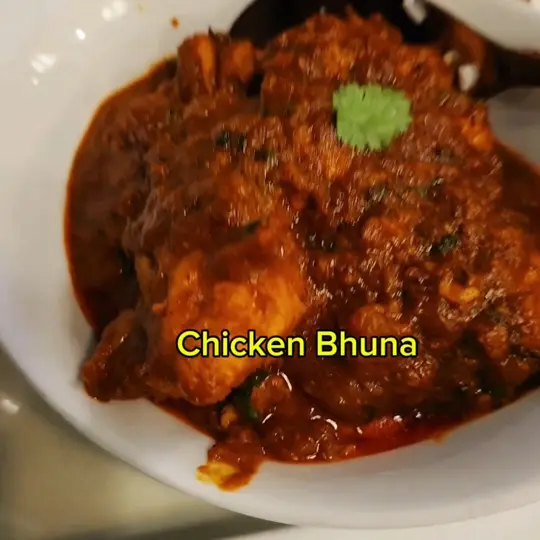 Coriander in Boynton Beach showing chicken bhuna, garlic bread, raita, video by Homemaker's Cookbook on YouTube