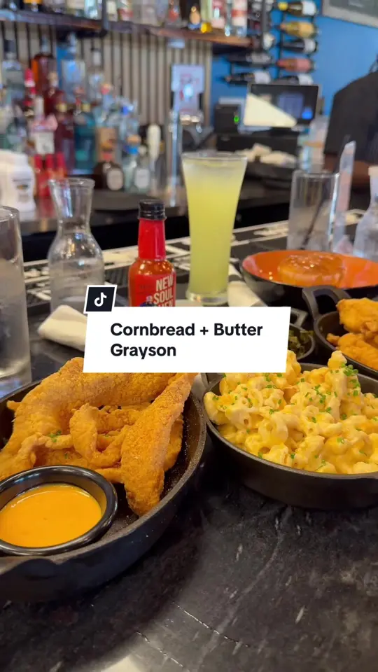 Cornbread + Butter by Chef Jernard Wells in Grayson showing review, catfish strips, salmon bites, macaroni and cheese, collard greens, strawberry ginger lemonade, video by life.as.jos on TikTok