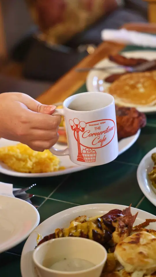 Corner Stone Café in Ellijay showing breakfast, pancakes, fried apple fritters, biscuits with eggs and gravy, omelets, coffee, video by Pick Ellijay on Facebook