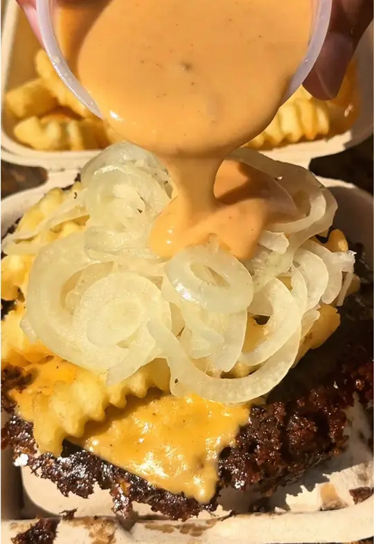 Cow & Cheese in Maitland showing burger, cheese sauce, fries, video by eatcowandcheese on TikTok