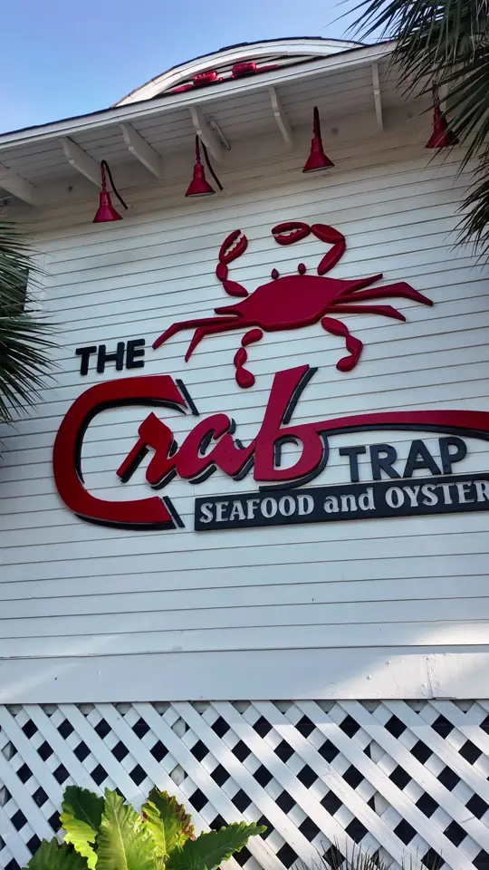 Crab Trap Destin in Destin showing review, visit, chicken pasta, creamy chicken pasta, crab topped salmon, wild rice and veggies, video by mr.goalchaser on TikTok