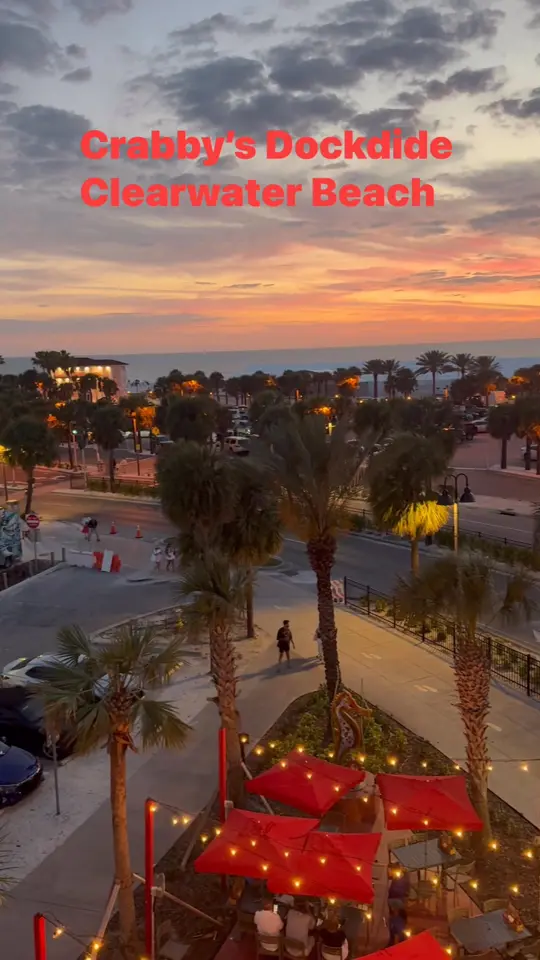 Crabby's Dockside in Clearwater showing atmosphere, sunset, video by Crabby's Dockside Clearwater Beach on Facebook