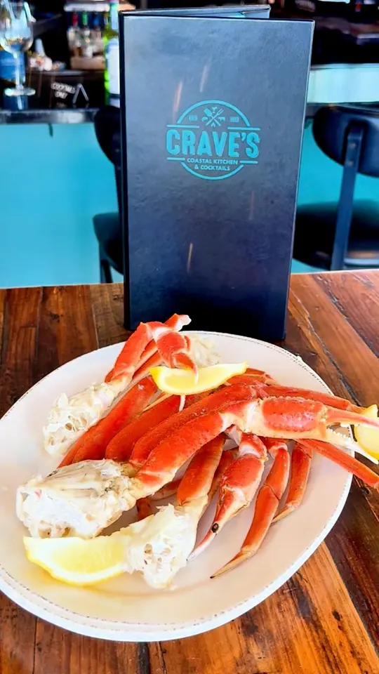 Crave's Coastal Kitchen & Cocktails in Flagler Beach showing food, crab legs, tuesday special, video by Crave's Coastal Kitchen & Cocktails on Facebook
