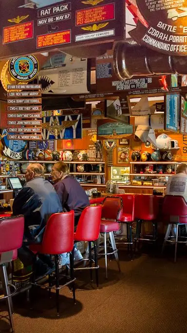 Cubi Bar Café in Pensacola showing visit, atmosphere, bar furnishings, video by National Naval Aviation Museum on Facebook