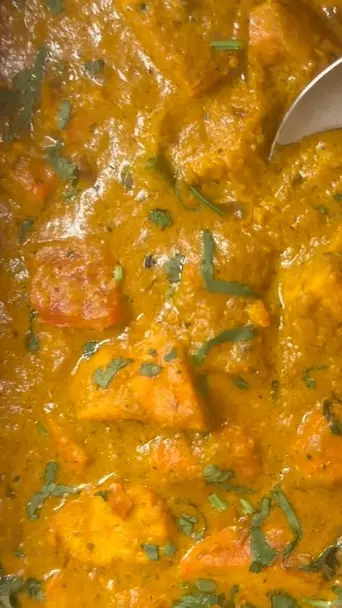 Curry express in Hinesville showing menu items, chicken tikka masala, chicken 65, goat curry, chana masala, vindi masala, onion pakora, butter naan, video by Curry Express on Facebook