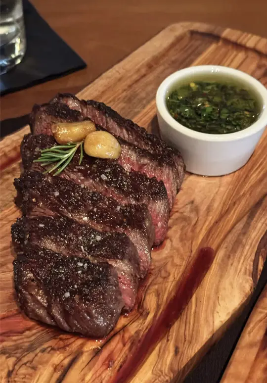 Cuts Steakhouse in Suwanee showing review, steak, australian wagyu, ceviche, wedge salad, mashed potatoes with green peppercorn sauce, chimichurri sauce, lounge area, cocktail bar, video by atlantabestbites on TikTok