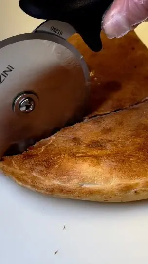D.P. Dough in Athens showing food, calzone, video by D.P. Dough Athens GA UGA on Facebook