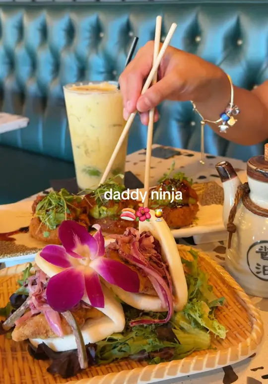 Daddy Ninja Restaurant in Kissimmee showing passionfruit sangria, coconut mojito, japanese bao w chicken katsu, croquetas de maduro, aloha roll, el fokin ninja roll, video by stalli.syd on TikTok