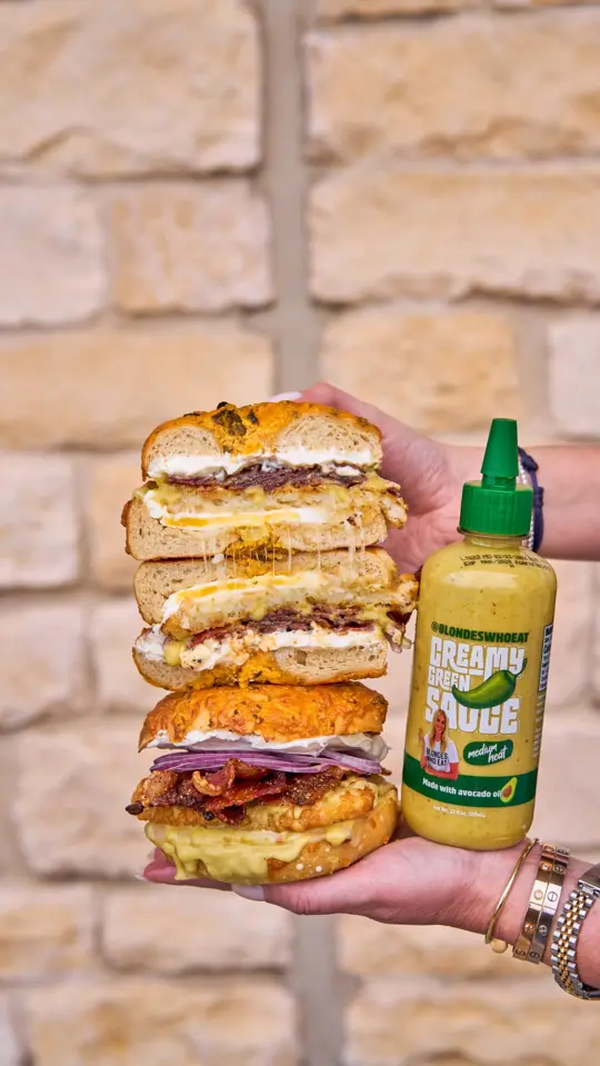 Dallas Bagels in Dallas showing food, jalapeño cheddar bagel sandwich, video by Blondes Who Eat on Facebook