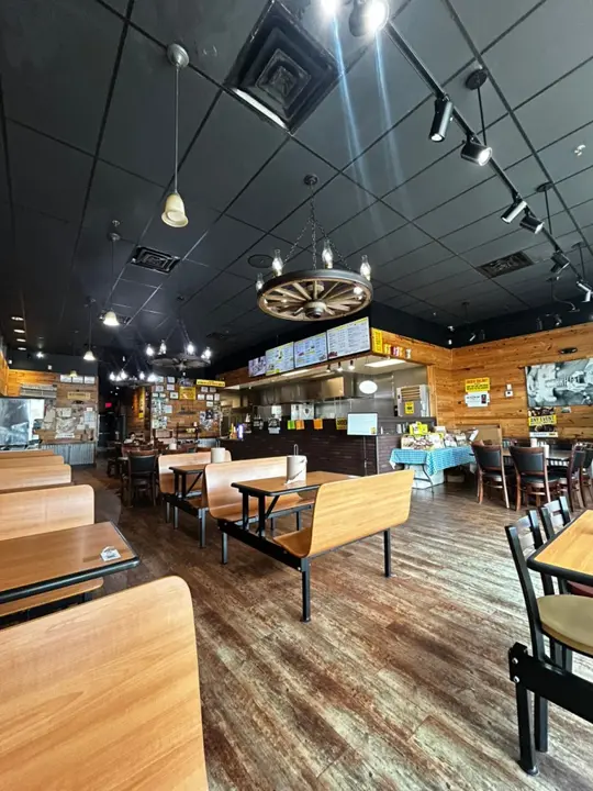 Dickey S Barbecue Pit Panama City Beach in Florida showing review, visit, pulled pork, brisket, ribs, sausage, sandwiches, loaded baked potatoes, mac and cheese, baked beans, fried okra, potato casserole, video by Chrissy Harris on Facebook