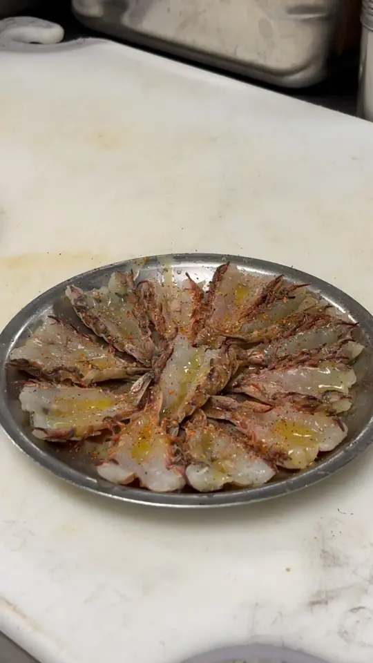 Dixie Crossroads in Titusville showing food, rock shrimp, video by Dixie Crossroads Seafood Restaurant on Facebook