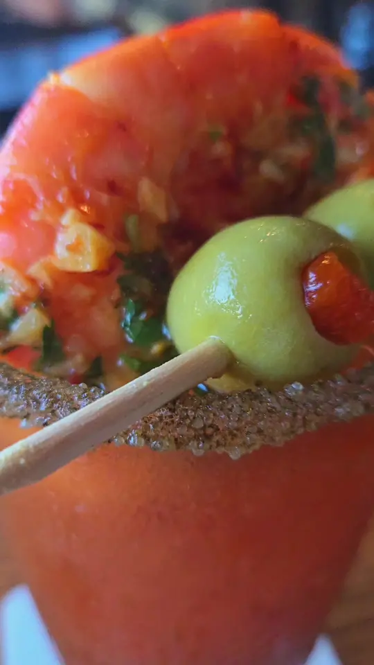 Doc Ford's Rum Bar And Grille St Pete Pier in St. Petersburg showing food, yucatan shrimp, cocktail, doc's yucatan bloody mary, food, macadamia nut crusted grouper, video by swflfoodjunkie on TikTok