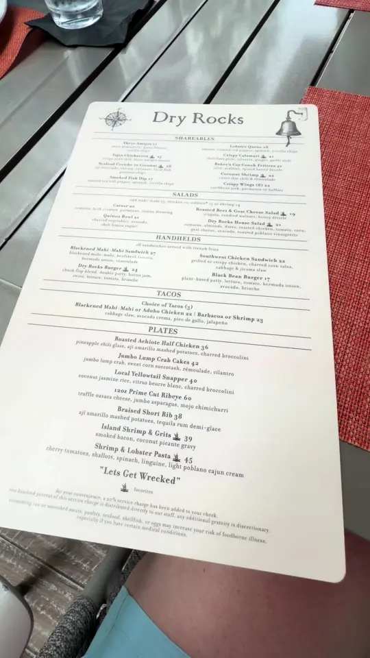 Dry Rocks in Key Largo showing dinner, coconut shrimp, blackened mahi sandwich, strawberries, video by adventurewithwhit on TikTok