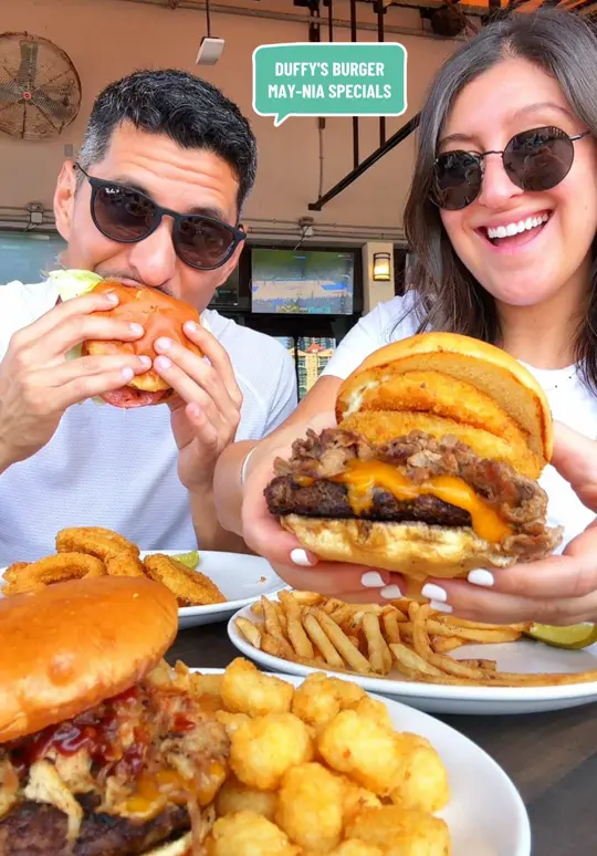 Duffy's Sports Grill in Tampa showing food, duffy's burger may-nia, the boss hog, double smash burger, primetime burger, video by taystytravels on TikTok