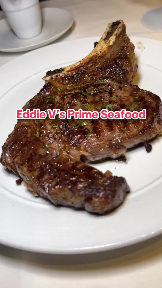 Eddie V's Prime Seafood in Boca Raton showing prime ribeye steak, truffle mac & cheese, lamb chops, banana foster butter cake, jumbo lump crab cake, video by mostasting on TikTok