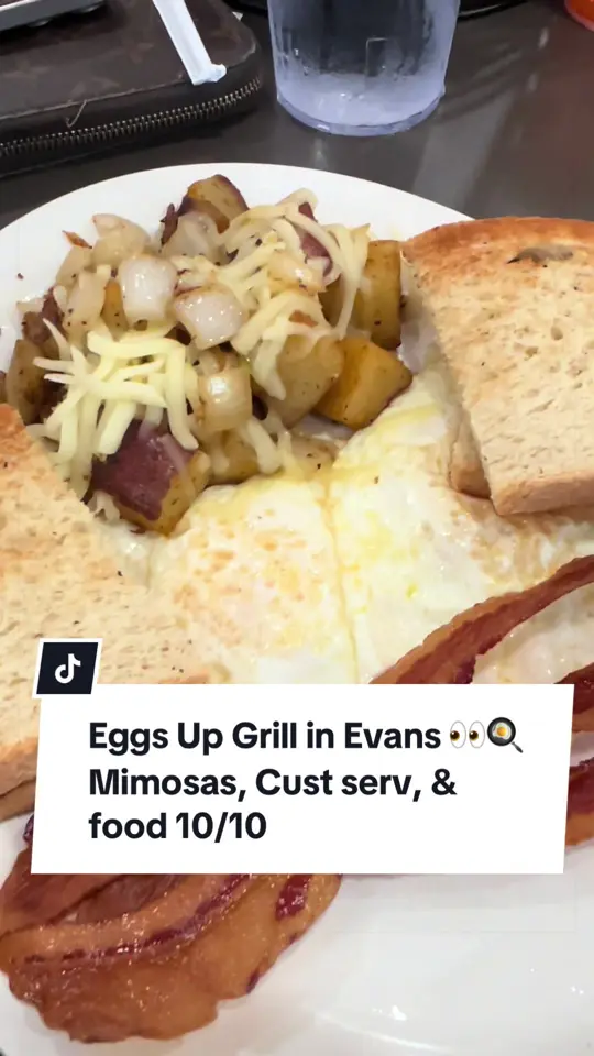 Eggs Up Grill in Evans showing review, food, mimosas, video by prettymsparker on TikTok