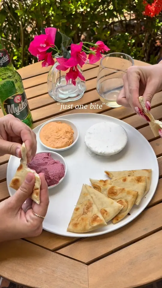 El Greco Kitchen & Market in Sarasota showing food, pita, house-made spreads, video by El Greco Kitchen & Market on Facebook