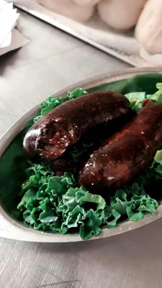 El Puerto Restaurant & Grill in Tampa showing food, blood sausage, side dish, fried plantains, video by El Puerto Restaurant & Grill on Facebook