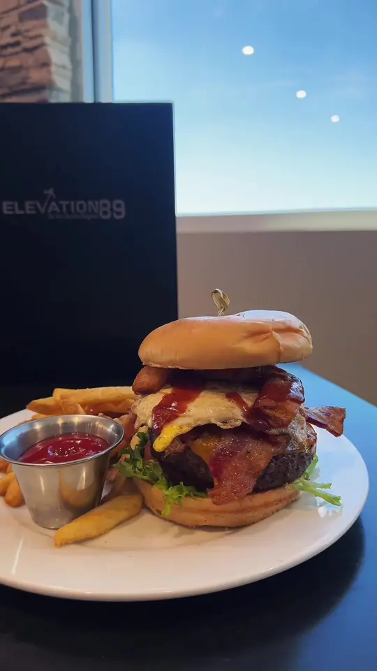 Elevation 89 in Ocala showing food, bison burger with fried egg and fries, video by nievesmedia on TikTok