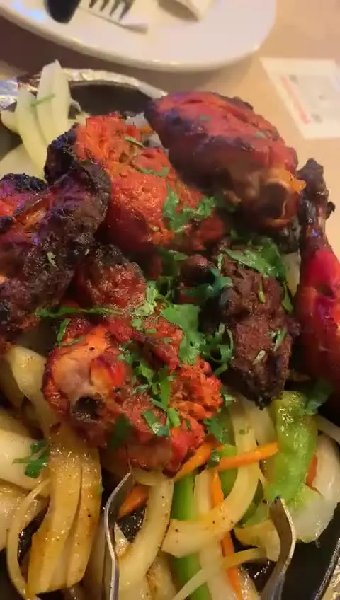 Essence Of India in Tallahassee showing food, tandoori chicken, video by Essence of India on Facebook