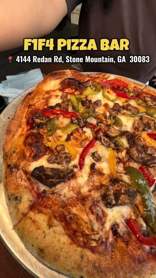 F1F4 Pizza Bar in Stone Mountain showing food, shottas pizza, jerk chicken, grilled pineapple, bell peppers, jerk bbq sauce, video by atl.yummyeats on TikTok