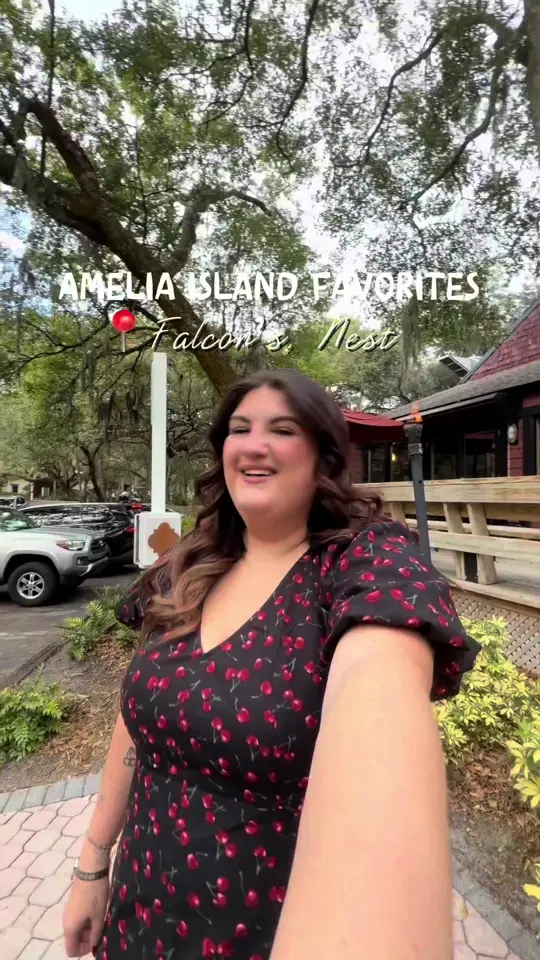 Falcon's Nest Restaurant in Kissimmee showing food, duster dog, barrel roll tater tots, drinks, atmosphere, game day energy, video by mangiawithtay on TikTok
