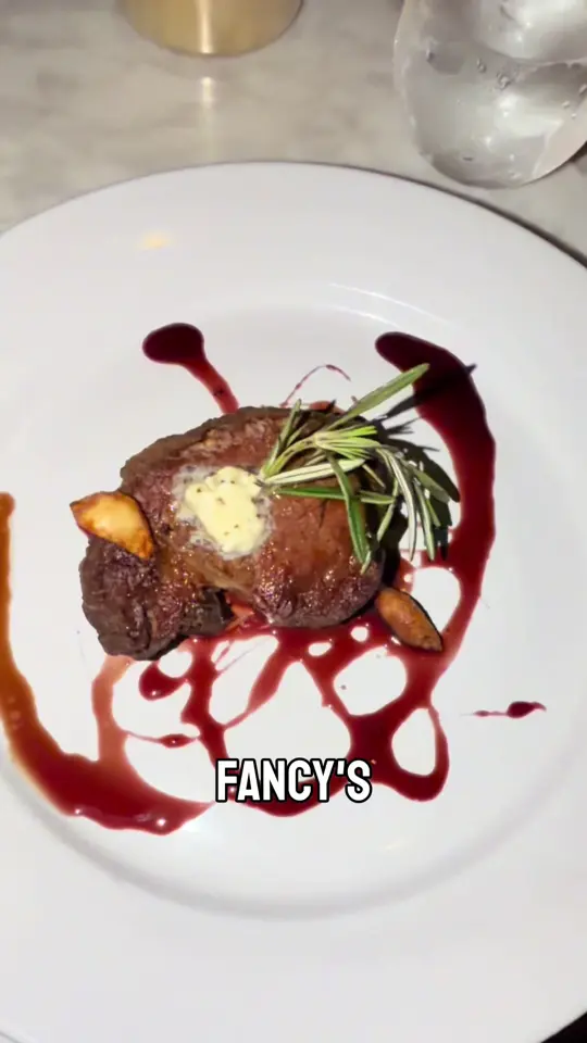 Fancy's Southern Cafe in Fort Myers showing restaurant visit, macadamia nut grouper, fried green tomatoes, chicken and waffles, macaroni and cheese, filet mignon, sweet potato fries, virgin old fashioned, video by whatsupftmyers on TikTok