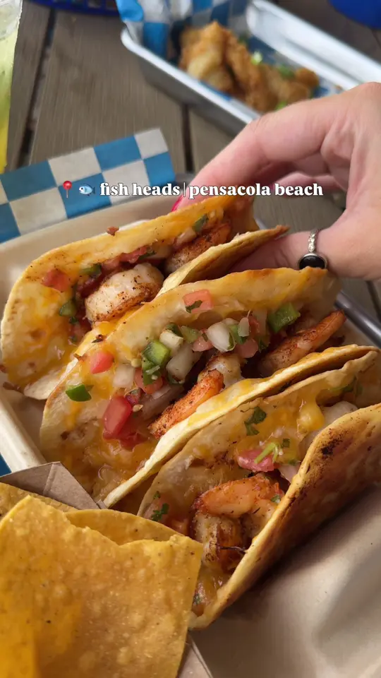 Fish Heads in Pensacola Beach showing food, tacodillas, atmosphere, covered deck, beach view, video by pcola.eats on TikTok