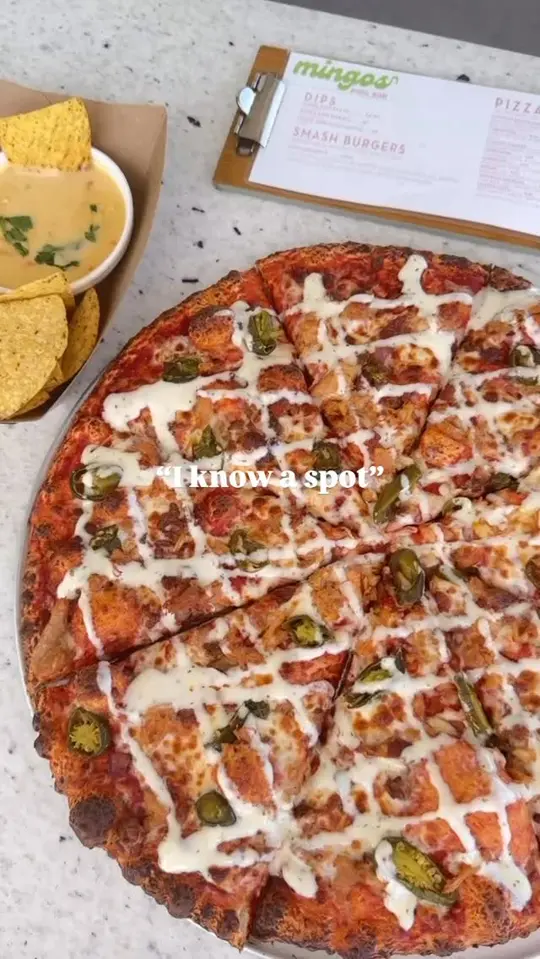Flamingo Jo’s Beach Bar in Panama City Beach showing cocktail, pizza, beach bar atmosphere, video by Flamingo Hotel and Tower on Facebook