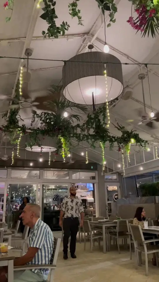 Floridian Restaurant in Fort Lauderdale showing review, waterfront restaurant visit, ambiance, atmosphere, food, drinks, video by travelwiththehamiltons on TikTok