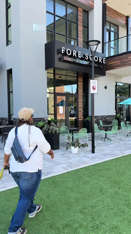 Fore Score Gate Parkway in Jacksonville showing review, visit, happy hour, food, drinks, indoor golf simulators, football games, bowling-style challenges, video by allthingsjacksonville on TikTok