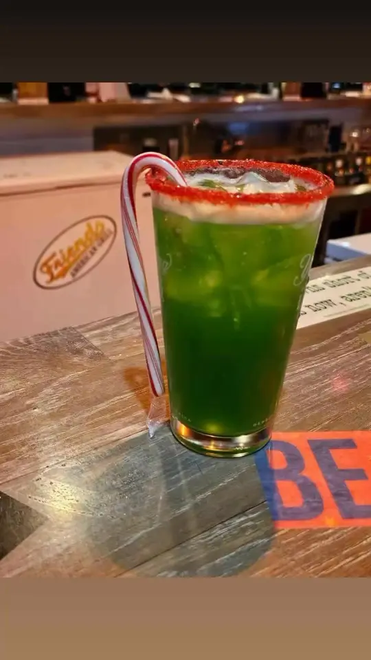 FRIENDS CUMMING GRILL in Cumming showing drink, grinch shot, snack, santa's snacks, video by Friends Cumming Grill on Facebook