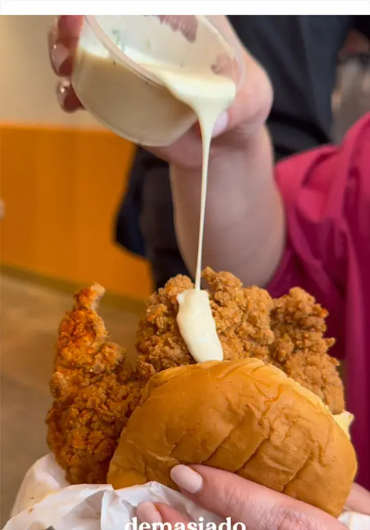 Fuku in Coral Gables showing sandwich, tenders, cucumber salad, gem salad, party fries, sauces, video by thehungrypost on TikTok