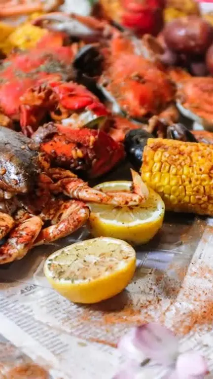 G'ville Seafood N' Chicken in Gainesville showing seafood boil, corn, video by Mr. & Mrs. Crab Juicy Seafood & Bar Gain on Facebook