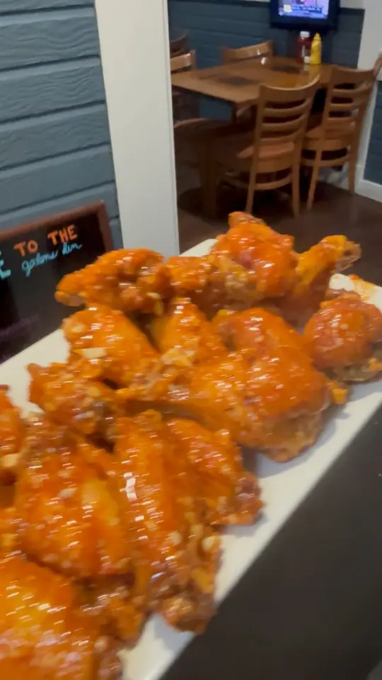 GATORS DEN SPORTS GRILL in Gainesville showing food, wings, video by Gators Den Sports Grill on Facebook
