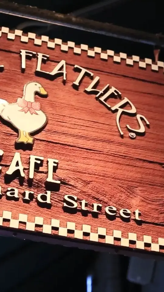 Goose Feathers Cafe & Bakery in Savannah showing event, 40th anniversary celebration, live music, new menu items, merchandise, video by Goose Feathers - Cafe and Bakery on Facebook