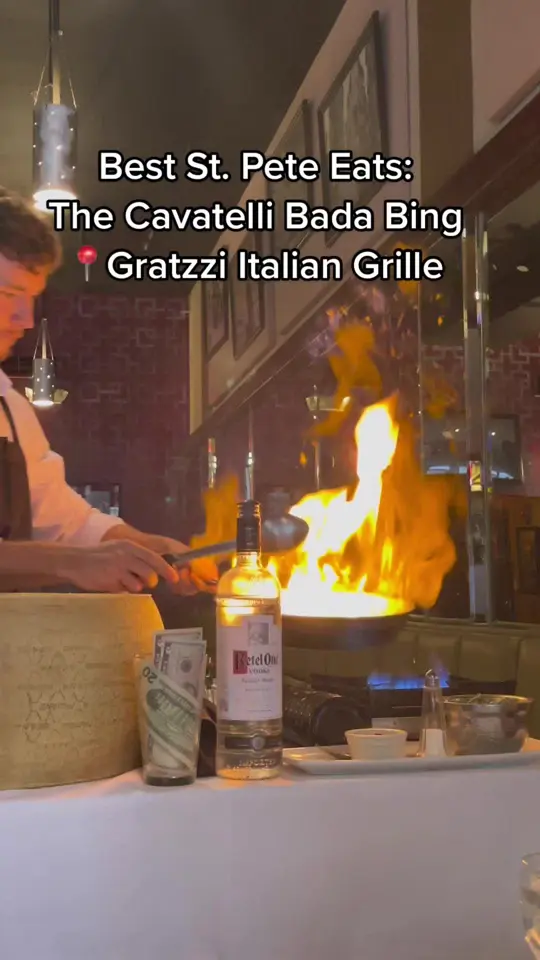 Gratzzi Italian Grille in St. Petersburg showing dinner, show, pasta, cheesepull, flambe, video by ilovetheburgstpete on TikTok