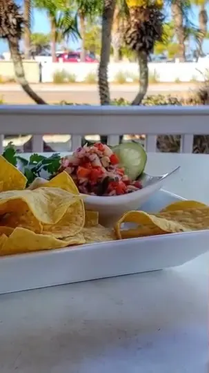 Guppy's On the Beach in Indian Rocks Beach showing hot sauce, menu item, video by Guppy's on the Beach Grill & Bar on Facebook
