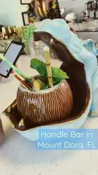 HandleBar in Mount Dora showing cocktail, crazy blue hippo cocktail, video by How We Find Happy on YouTube