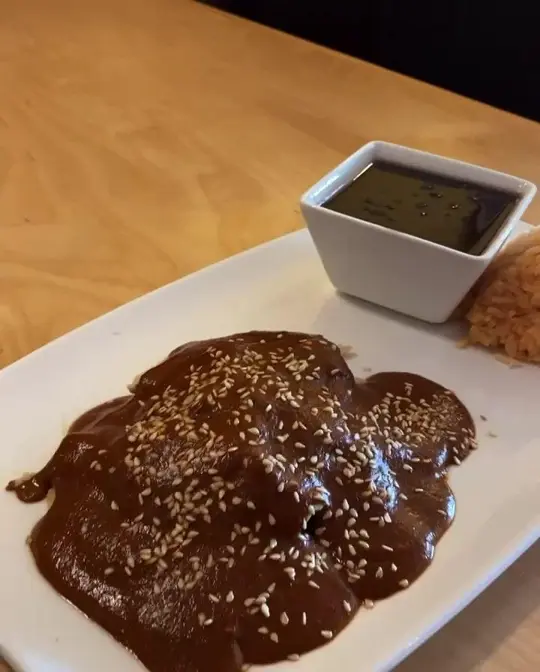 Happy Cactus Mexican Cocina in Dunedin showing food, mole poblano, video by Happy Cactus Mexican Cocina on Facebook