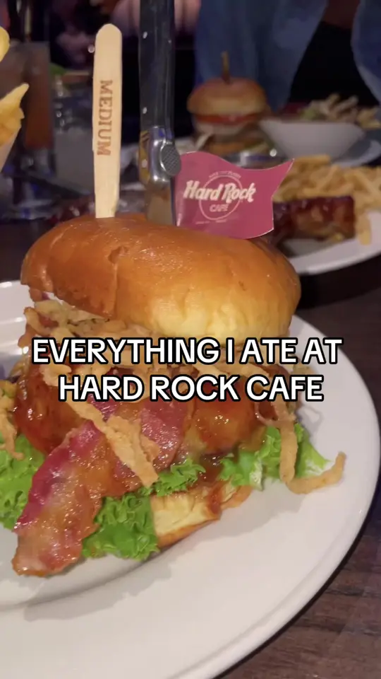 Hard Rock Cafe Miami in Miami showing food review, hard rock onion rings, spicy shrimp, messi chicken sandwich, bbq bacon cheeseburger, baby back ribs, hot fudge brownie sundae, video by jackiegrubs on TikTok