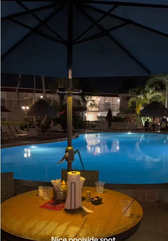 Harold's Place Chickee Bar And Grill in Naples showing cocktail, poolside tiki bar, video by travelin_with_nelson on TikTok