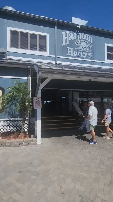 Harpoon Harry's Beachfront Restaurant in Panama City Beach showing visit, open-air deck, cold drink, video by Harpoon Harry's Dockside Dining on Facebook