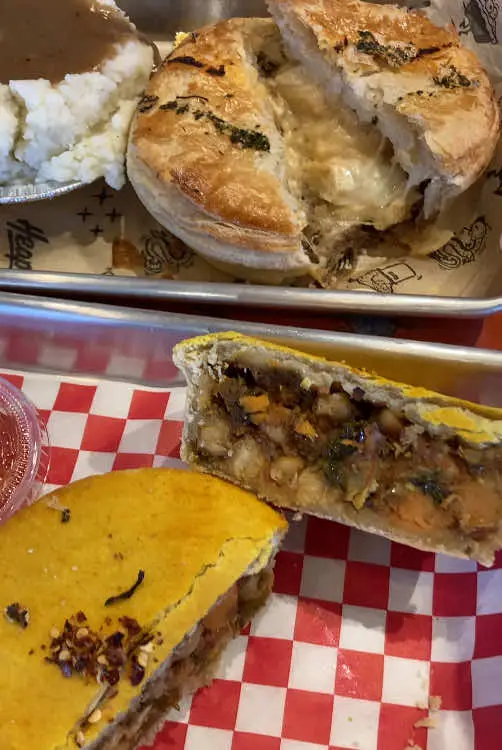 Heaps Pies in Decatur showing review, vegan chana masala pie, fish and chips, video by eatsbyliliatl on TikTok