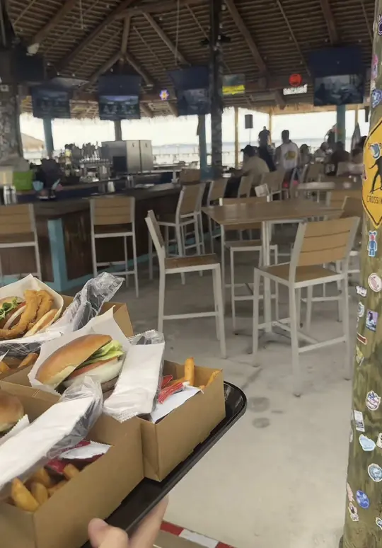 Hideaway Beach Bar in Pensacola Beach showing review, visit, smash burgers, tacos, hot honey chicken sandwiches, live music, video by haleyparkerstyle on TikTok