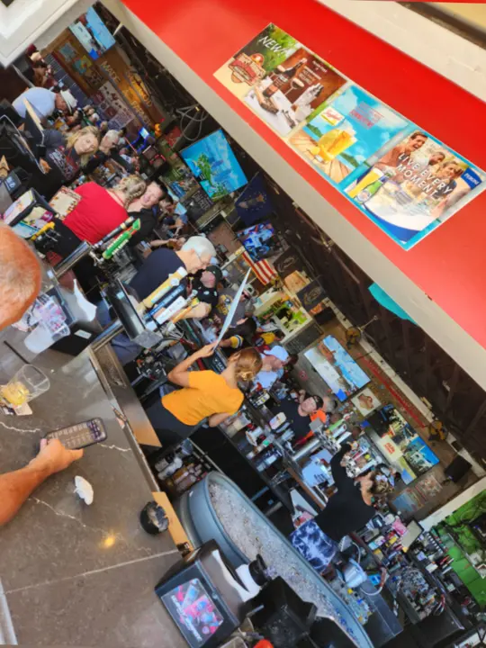 Hogg Daddy's Beach Bar & Grill in Clearwater Beach showing college football, pre-game show, kickoff, video by hoggdaddysclwb on TikTok