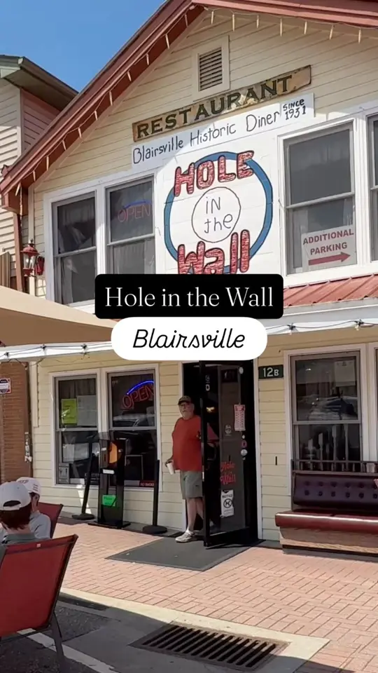 Hole In The Wall in Blairsville showing review, visit, eggs benedict, hashbrowns, video by Mountains and Main on Facebook