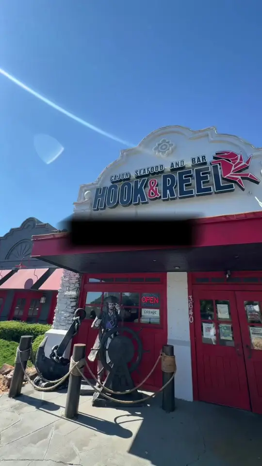 Hook & Reel Cajun Seafood & Bar in Athens showing seafood boil, restaurant visit, video by msqualified on TikTok