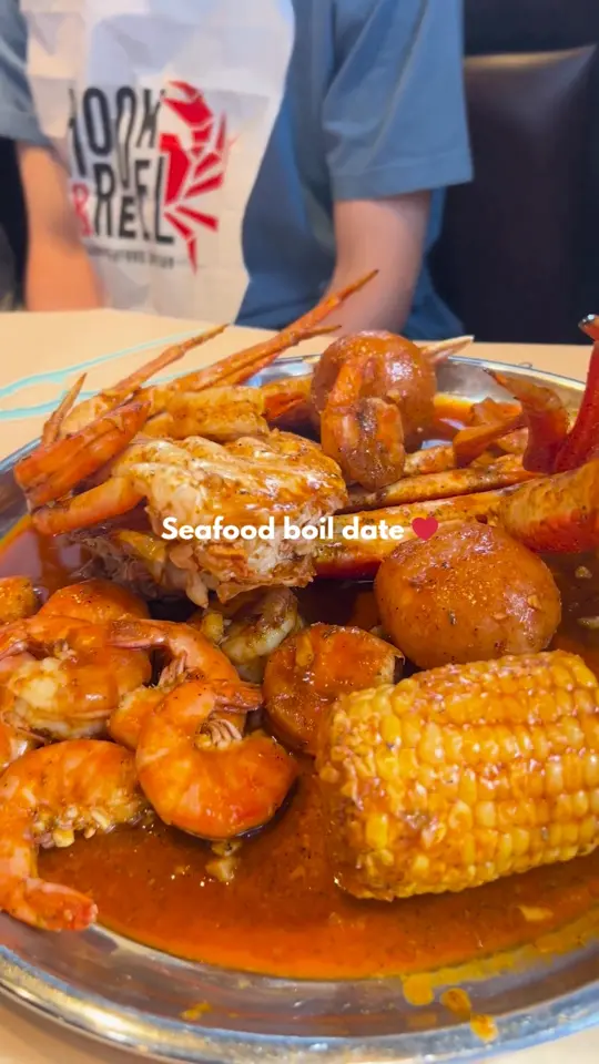 Hook & Reel Cajun Seafood & Bar in Snellville showing restaurant visit, seafood boil, video by Hook & Reel Cajun Seafood & Bar on Facebook
